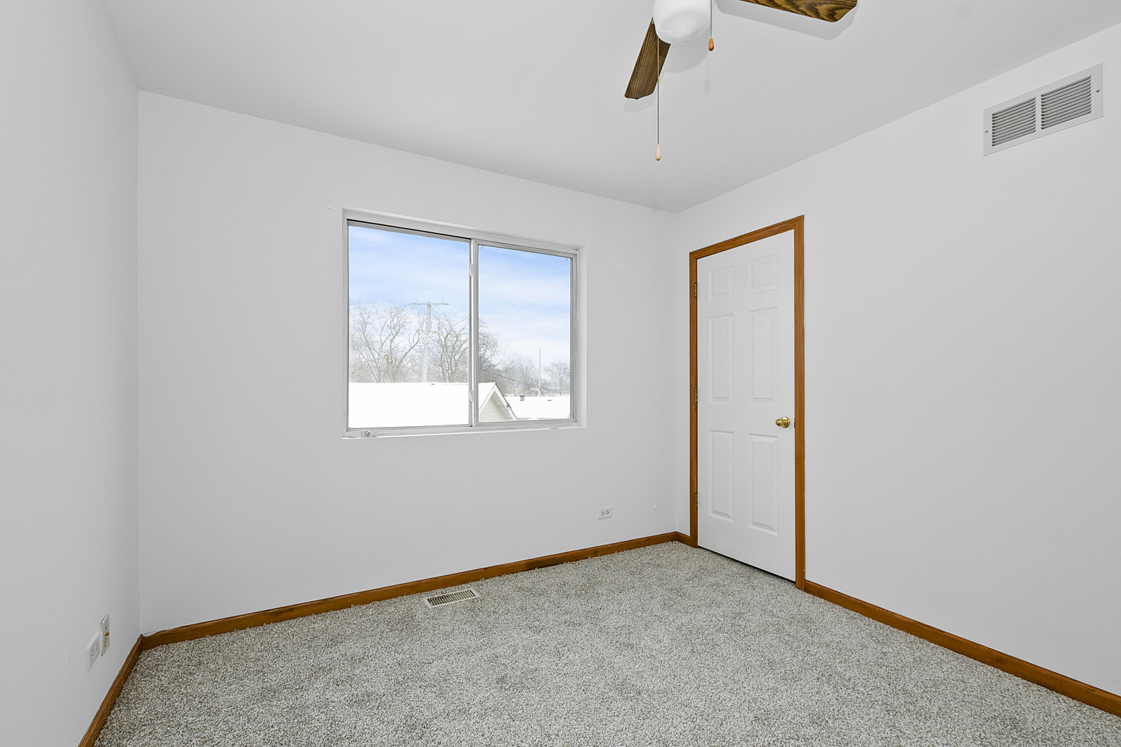 6823 Roberts Road Bridgeview, IL 60455 - Photo 9 of 22 a view of an empty room with a window