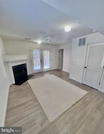 a large bedroom with a bed and a fireplace