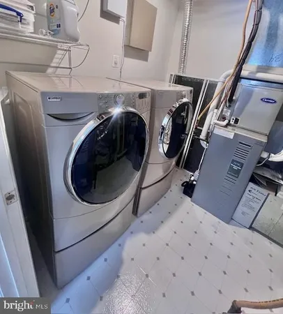 a utility room with dryer and washer