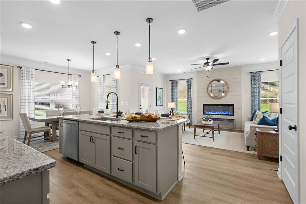 132 Andros Loop Dalton, GA 30721 - Photo 11 of 40 a kitchen with stainless steel appliances granite countertop stove top oven and cabinets