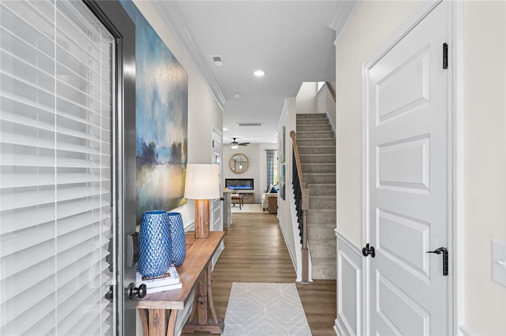 132 Andros Loop Dalton, GA 30721 - Photo 2 of 40 a view of a hallway with wooden floor and staircase