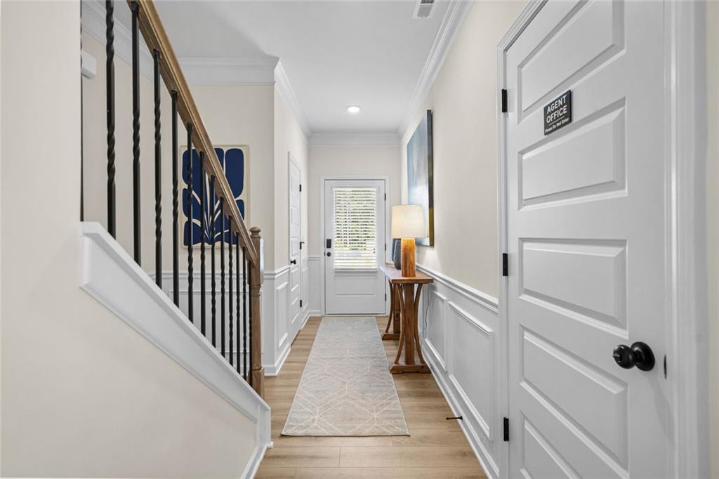 132 Andros Loop Dalton, GA 30721 - Photo 3 of 40 a view of a hallway with closet and wooden floor