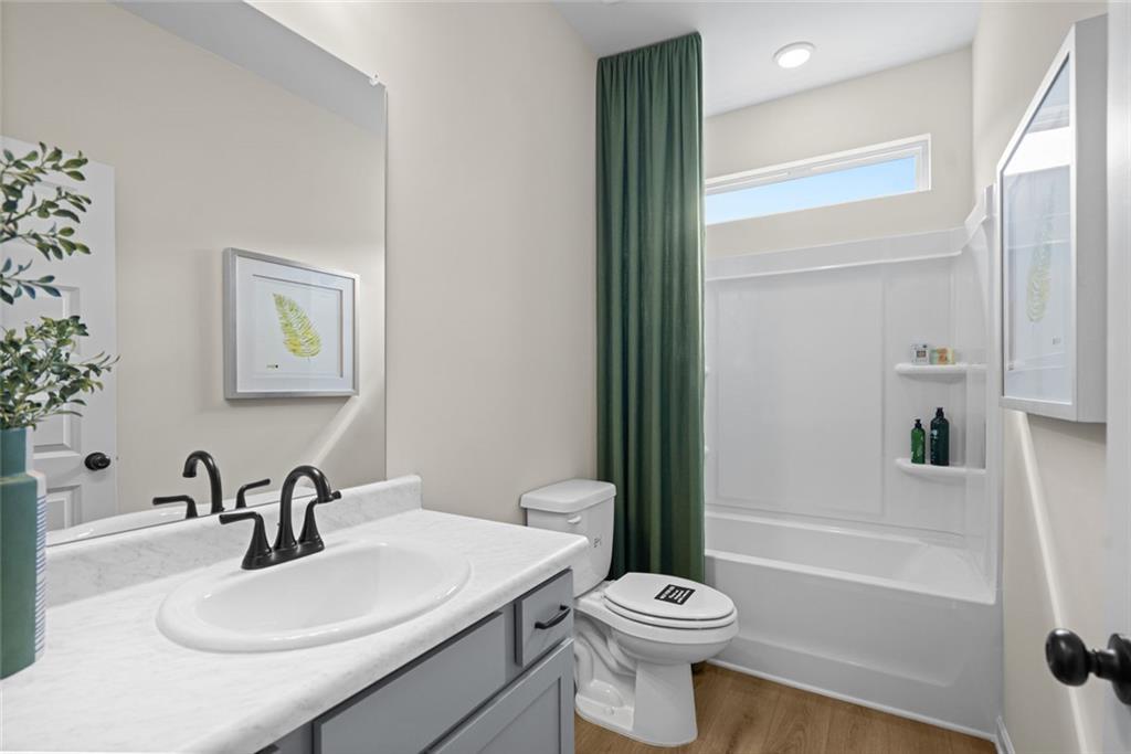 132 Andros Loop Dalton, GA 30721 - Photo 33 of 40 a bathroom with a sink toilet and shower