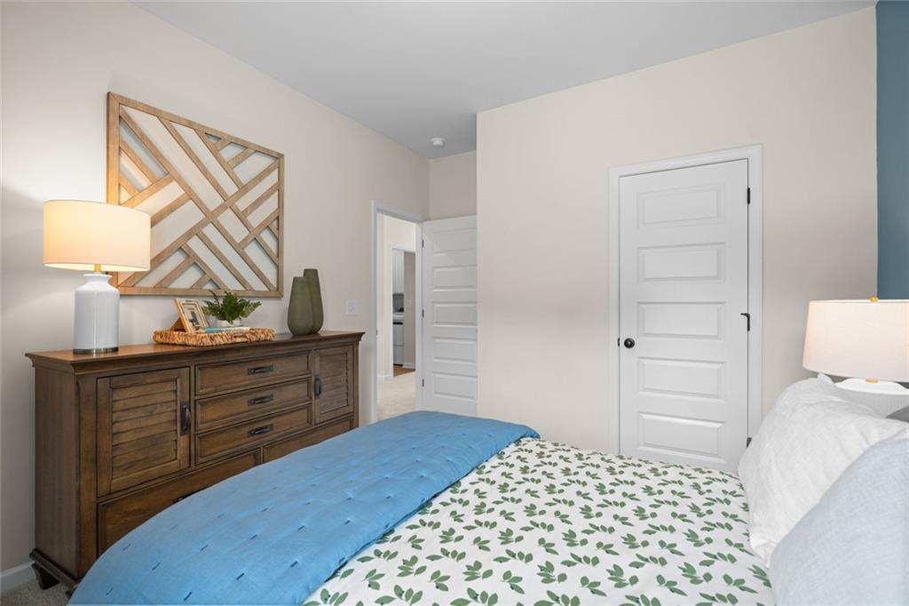 132 Andros Loop Dalton, GA 30721 - Photo 37 of 40 a bedroom with a bed and a dresser in it