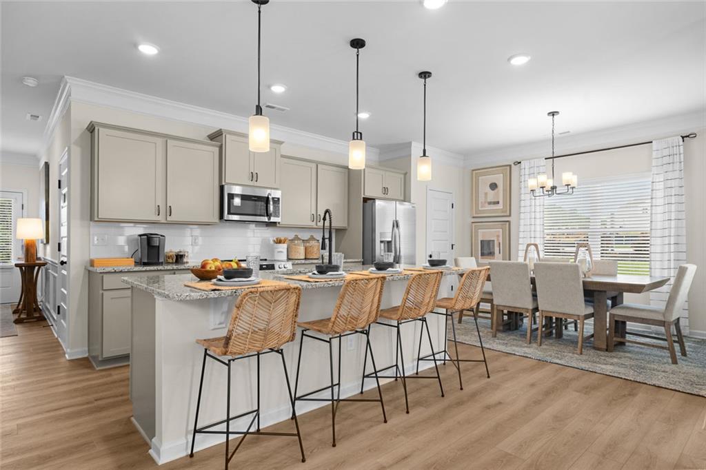 132 Andros Loop Dalton, GA 30721 - Photo 10 of 40 a large kitchen with lots of counter space and stainless steel appliances