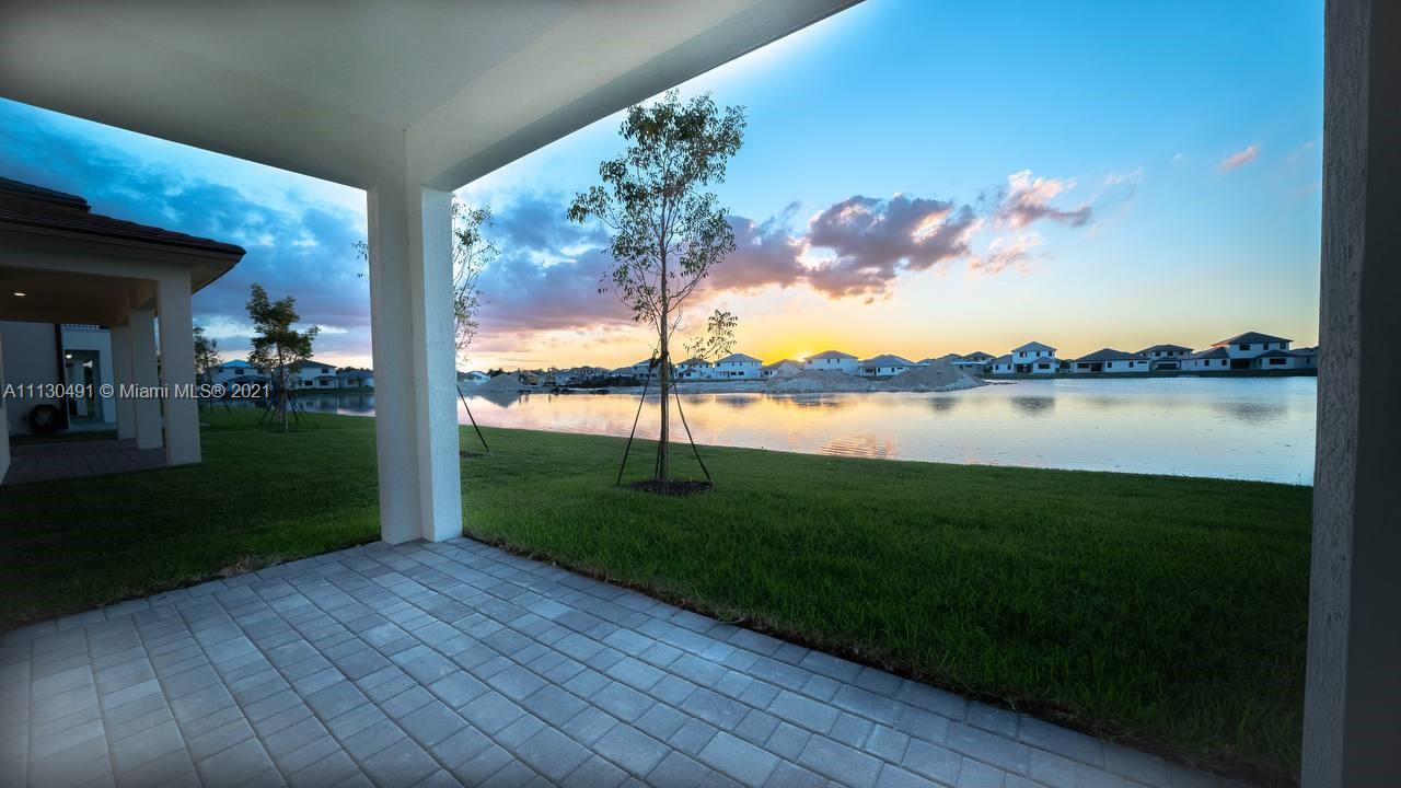 Sunset Lakes Miramar, FL 33029 - Photo 8 of 15 a view of a lake with a big yard