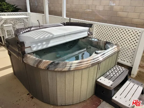 a view of a patio with table and chairs