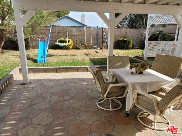 a view of balcony with wooden floor and fence