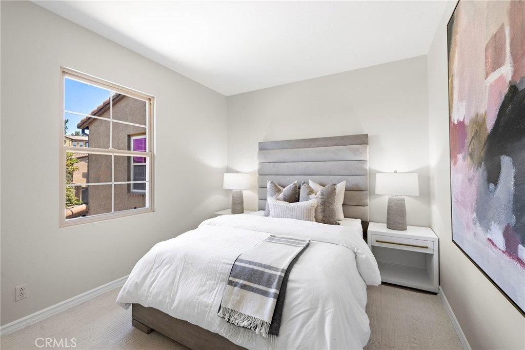 47 Tuscany Ladera Ranch, CA 92694 - Photo 20 of 28 a bedroom with a bed and a window