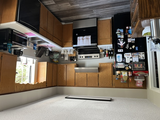 250 Elm Street Clemson, SC 29631 - Photo 3 of 7 Functional kitchen with ample cabinetry and essential appliances.