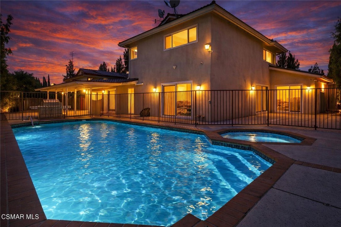 19051 Los Alimos Street Porter Ranch, CA 91326 - Photo 2 of 59 a view of a house with swimming pool