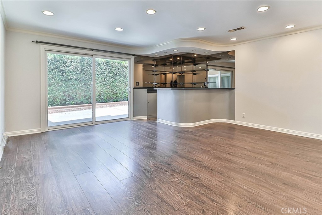 19051 Los Alimos Street Porter Ranch, CA 91326 - Photo 28 of 59 a view of a kitchen with a sink and wooden floor