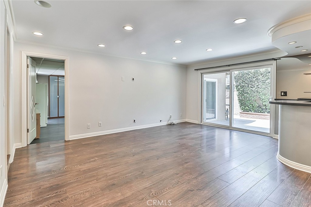 19051 Los Alimos Street Porter Ranch, CA 91326 - Photo 31 of 59 a view of empty room with wooden floor and fan
