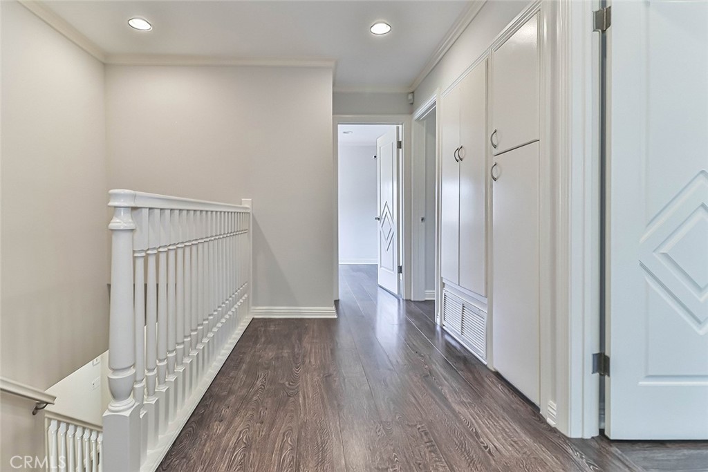 19051 Los Alimos Street Porter Ranch, CA 91326 - Photo 39 of 59 a view of a hallway with wooden floor
