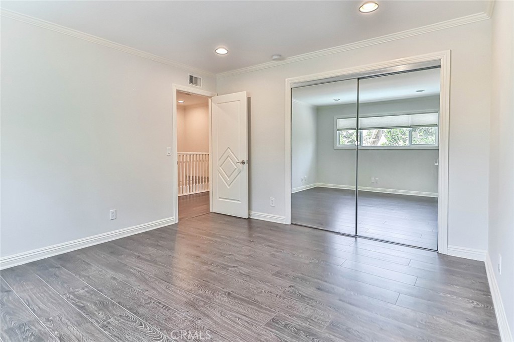 19051 Los Alimos Street Porter Ranch, CA 91326 - Photo 50 of 59 an empty room with wooden floor & closet area