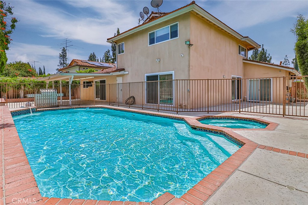 19051 Los Alimos Street Porter Ranch, CA 91326 - Photo 55 of 59 a front view of a house with yard