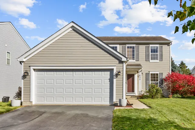 a view of a house with a yard