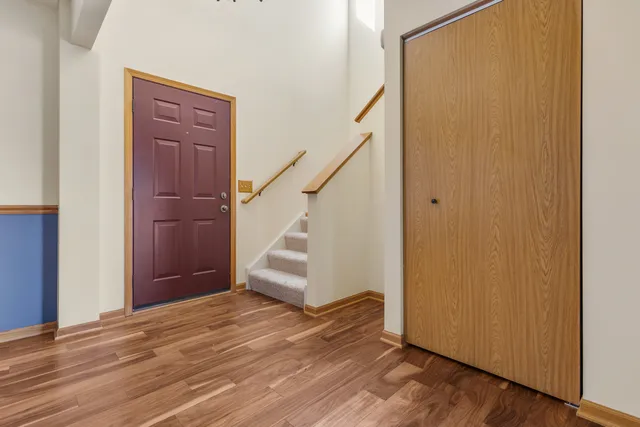 a view of entryway with wooden floor