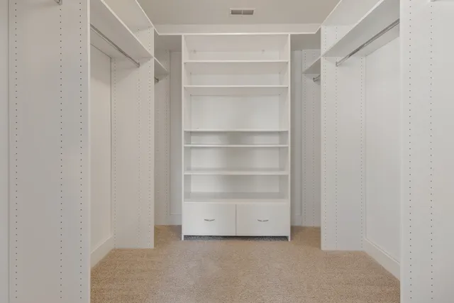 a view of an empty walk in closet