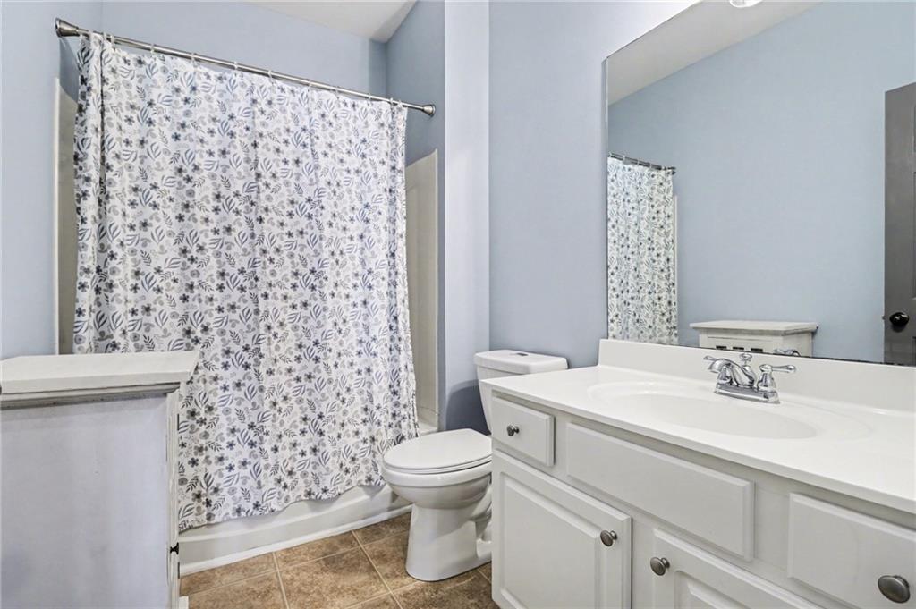1180 Ridenour Boulevard, Unit 5 Kennesaw, GA 30152 - Photo 18 of 22 a bathroom with a sink toilet and shower