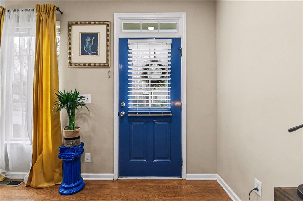 1180 Ridenour Boulevard, Unit 5 Kennesaw, GA 30152 - Photo 2 of 22 a view of hallway with livingroom and wooden floor
