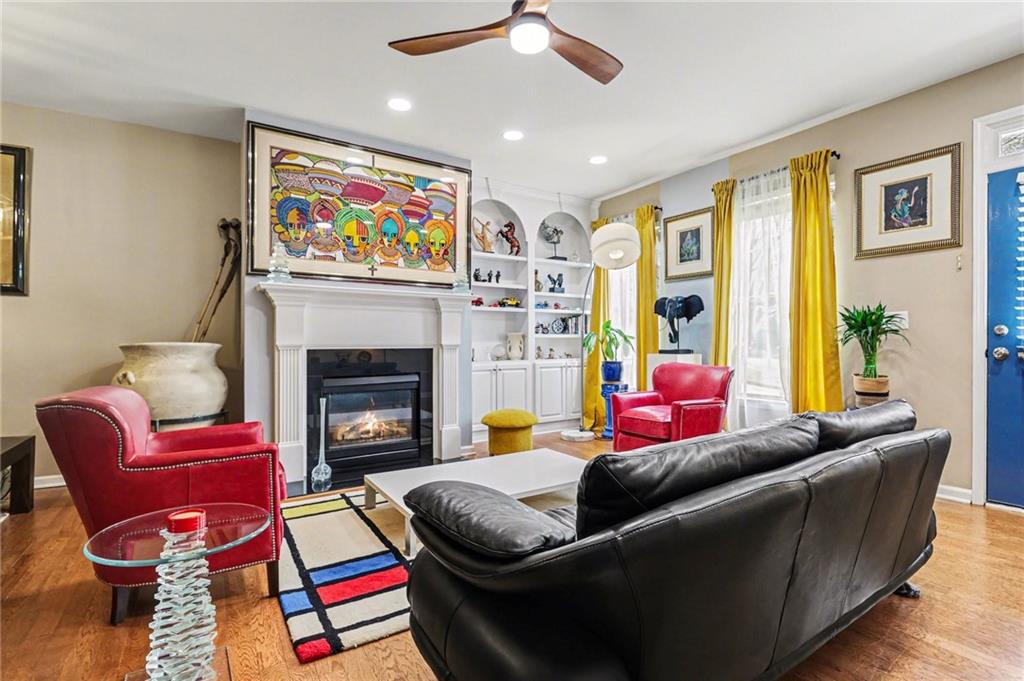 1180 Ridenour Boulevard, Unit 5 Kennesaw, GA 30152 - Photo 3 of 22 a living room with furniture and a fireplace