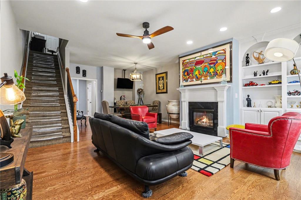 1180 Ridenour Boulevard, Unit 5 Kennesaw, GA 30152 - Photo 4 of 22 a living room with furniture and a fireplace