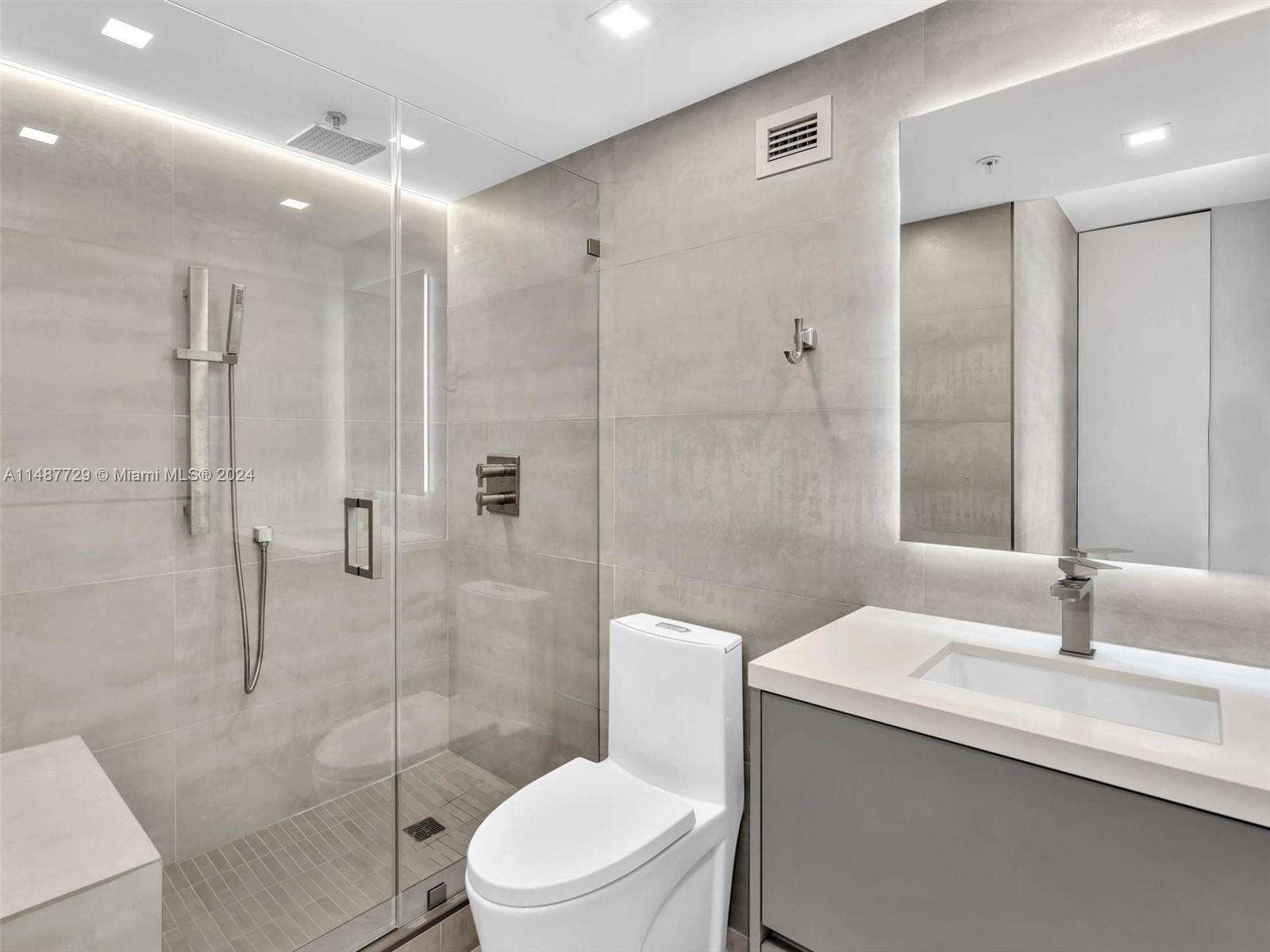 4101 Pine Tree Drive, Unit 621 620 Miami Beach, FL 33140 - Photo 27 of 73 a bathroom with a sink a toilet and shower