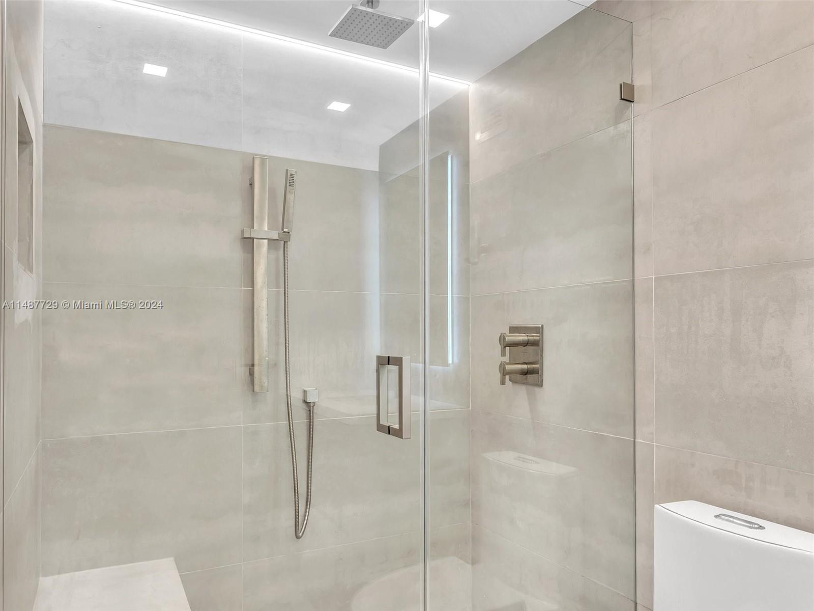 4101 Pine Tree Drive, Unit 621 620 Miami Beach, FL 33140 - Photo 28 of 73 a bathroom with a shower