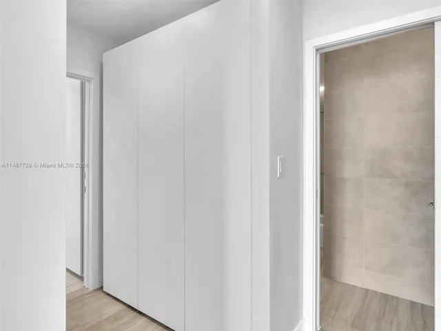 a kitchen with stainless steel appliances a sink a stove a refrigerator and cabinets