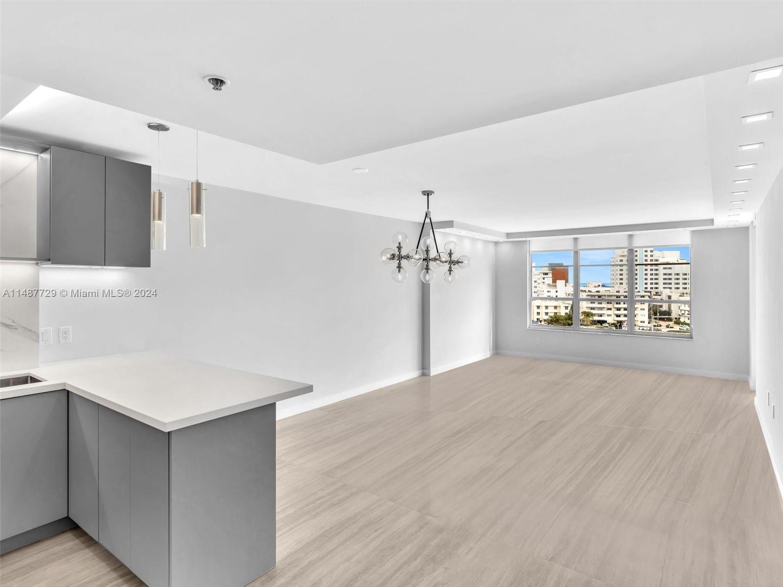 4101 Pine Tree Drive, Unit 621 620 Miami Beach, FL 33140 - Photo 39 of 73 a view of an empty room with a kitchen