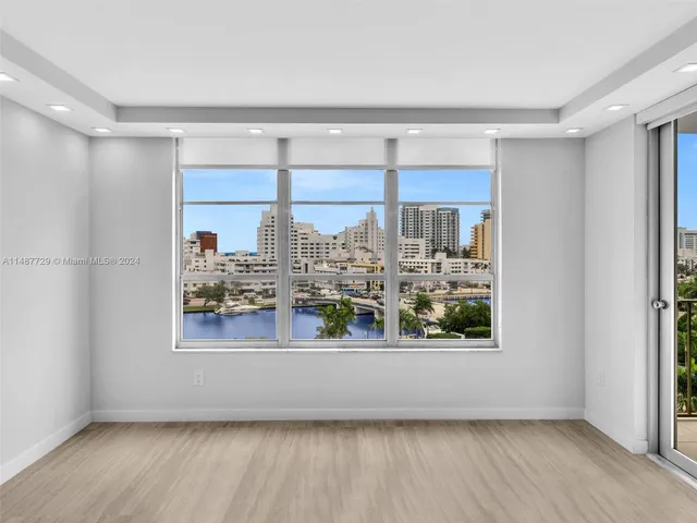 a view of swimming pool with outdoor seating and plants