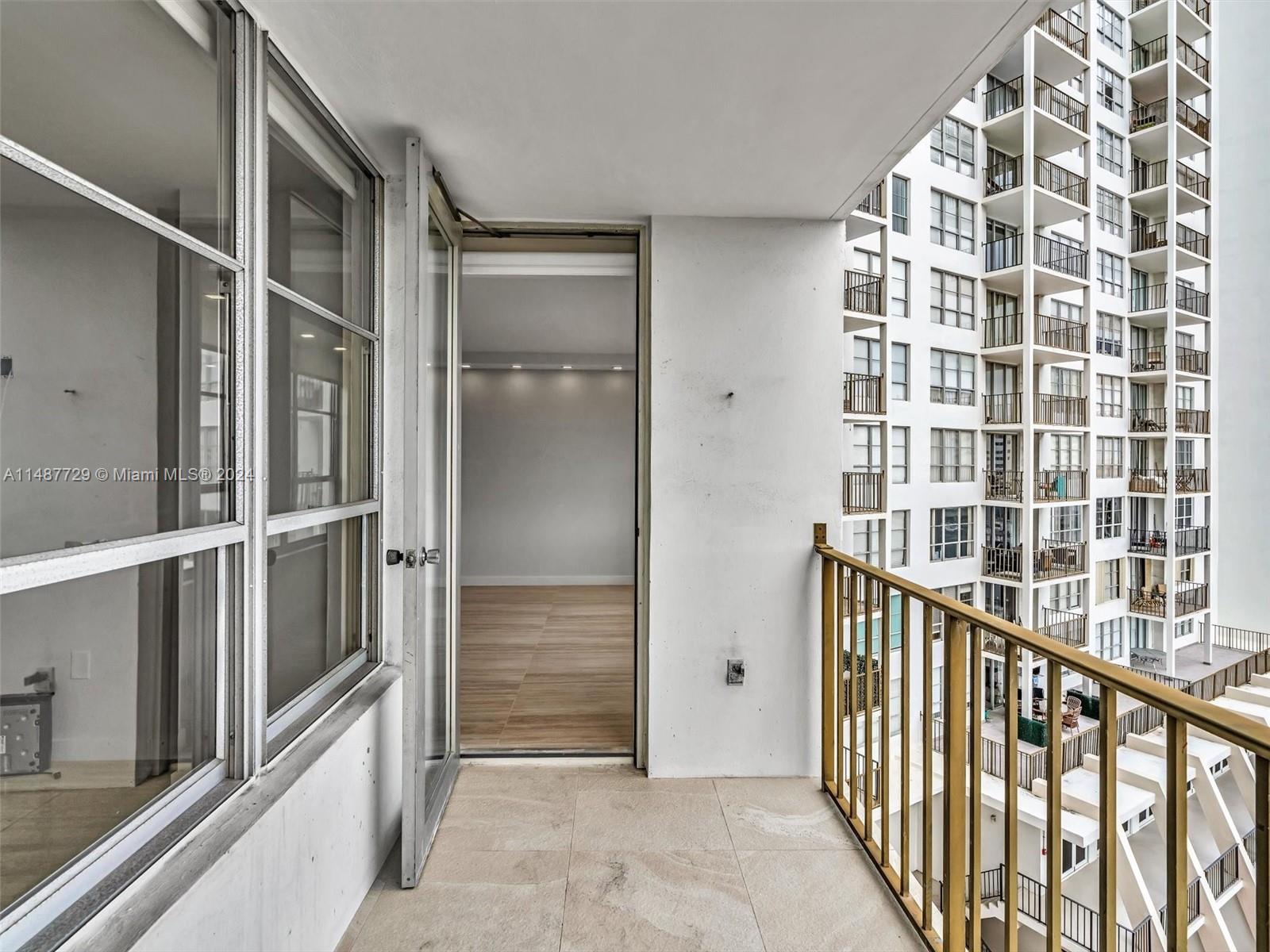 4101 Pine Tree Drive, Unit 621 620 Miami Beach, FL 33140 - Photo 50 of 73 a view of staircase with white walls and a shower