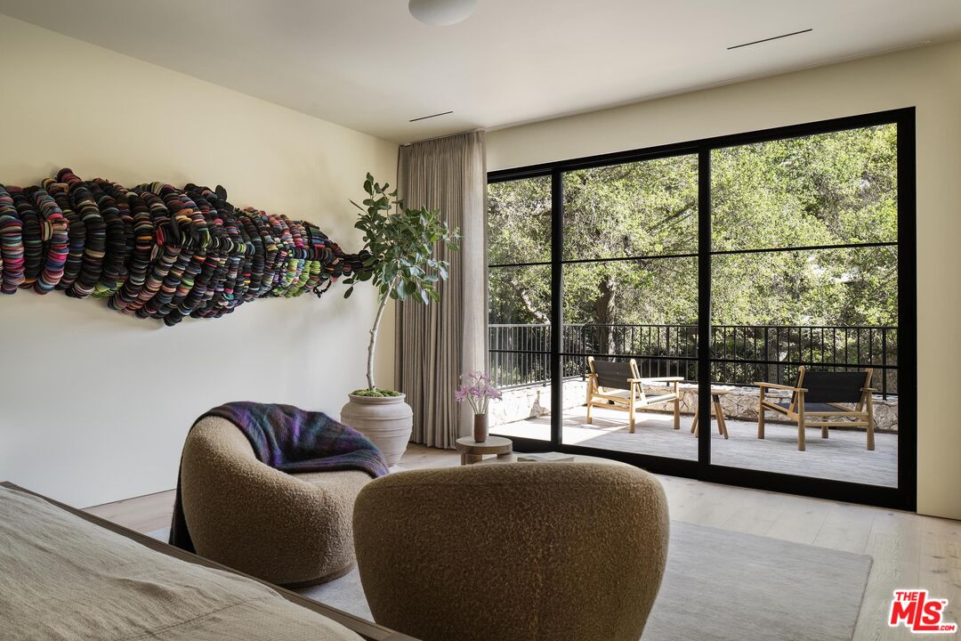 3274 Oakdell Road Studio City, CA 91604 - Photo 19 of 22 a living room with furniture and a floor to ceiling window