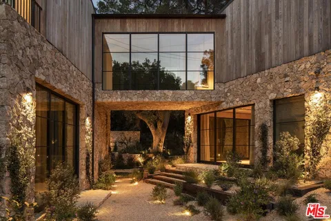a view of a house with roof and windows