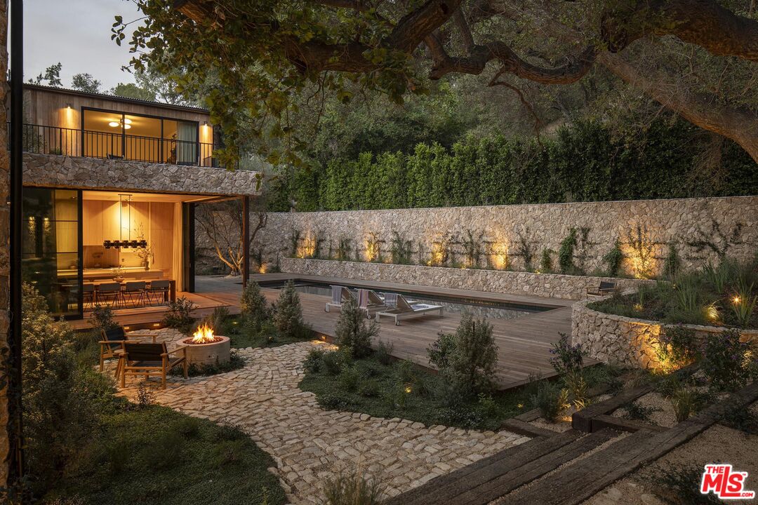 3274 Oakdell Road Studio City, CA 91604 - Photo 6 of 22 a view of a brick house with a yard