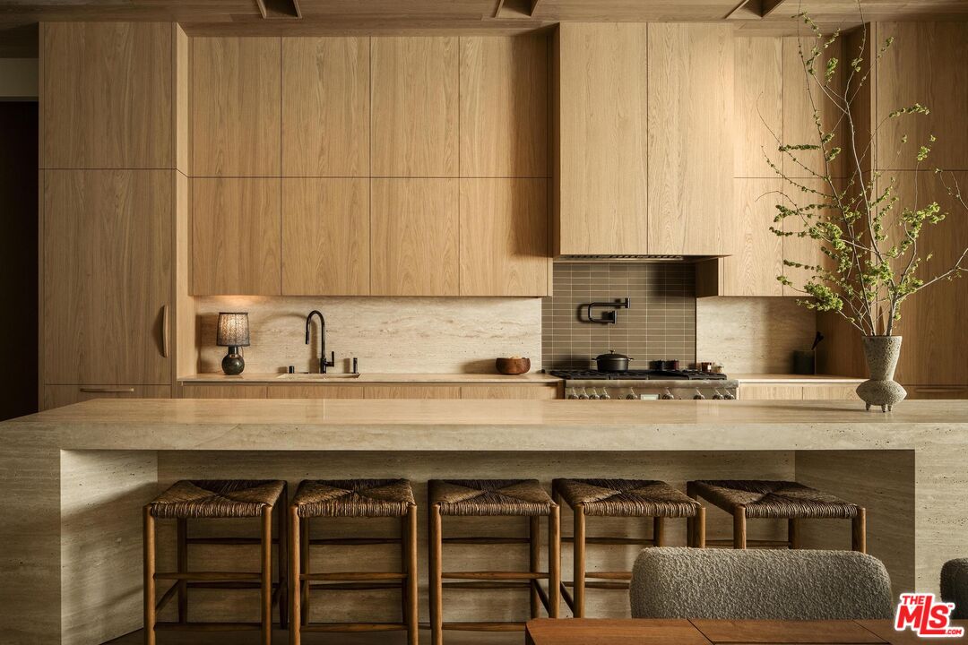 3274 Oakdell Road Studio City, CA 91604 - Photo 9 of 21 a kitchen with a stove a sink and cabinets