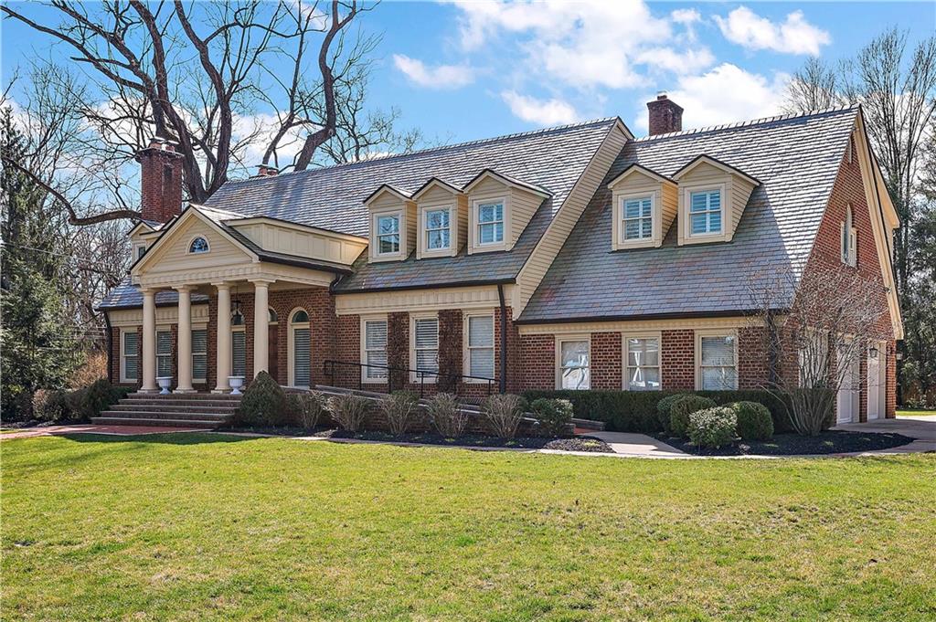 515 Maple Lane Sewickley, PA 15143 - Photo 1 of 42 a front view of a house with garden