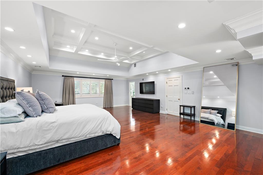 515 Maple Lane Sewickley, PA 15143 - Photo 23 of 42 a large bedroom with a bed and a view of kitchen