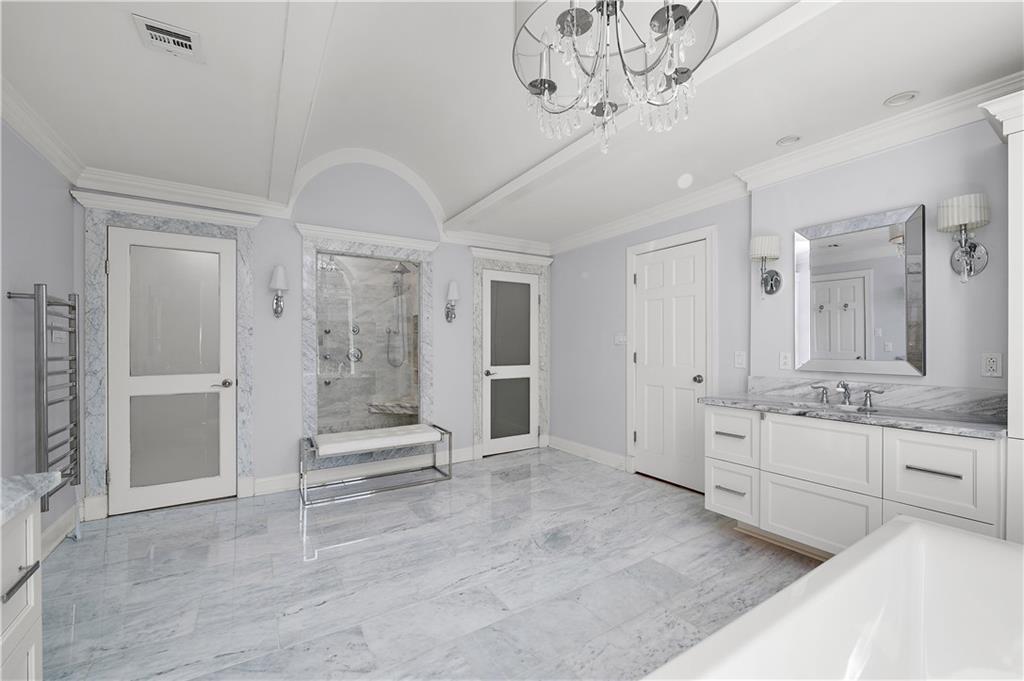 515 Maple Lane Sewickley, PA 15143 - Photo 26 of 42 a large en suite bathroom with a granite countertop sink a mirror a shower and bathtub