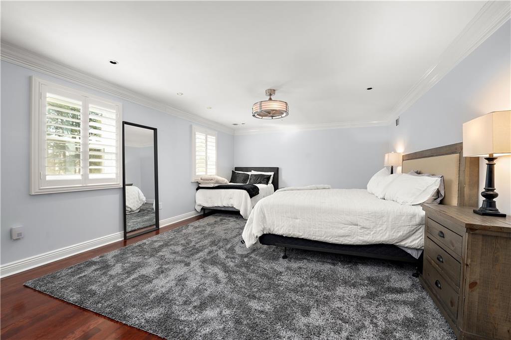 515 Maple Lane Sewickley, PA 15143 - Photo 35 of 42 a spacious bedroom with a bed and a lamp on dresser
