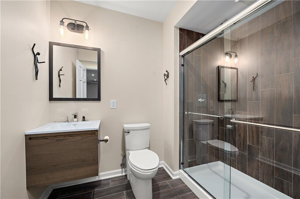 515 Maple Lane Sewickley, PA 15143 - Photo 40 of 42 a bathroom with a toilet sink and mirror