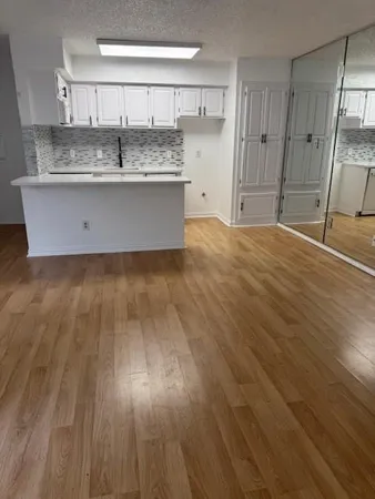 a view of kitchen with wooden floor