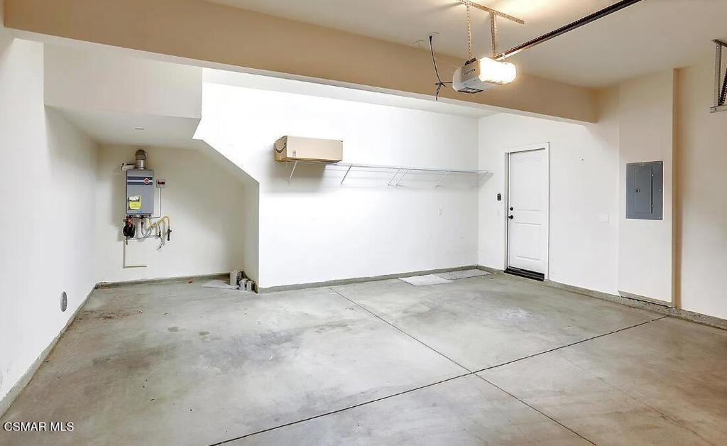 458 Stratus Lane, Unit 5 Simi Valley, CA 93065 - Photo 12 of 13 an empty room with a ceiling fan and carpet