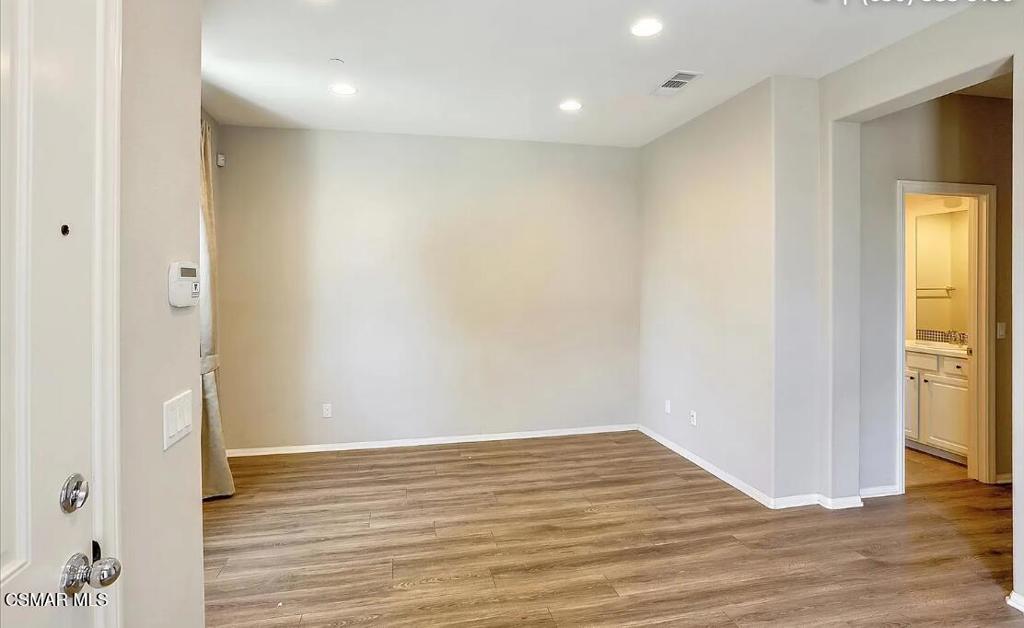 458 Stratus Lane, Unit 5 Simi Valley, CA 93065 - Photo 9 of 13 a view of empty room with wooden floor