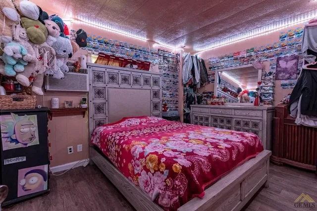 a bedroom with a bed and a mirror