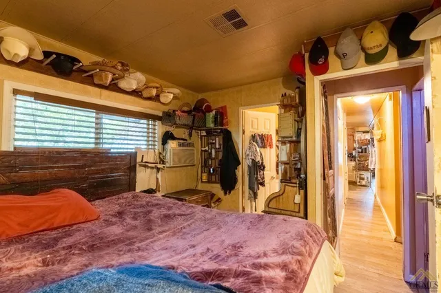 a bedroom with a bed and a closet
