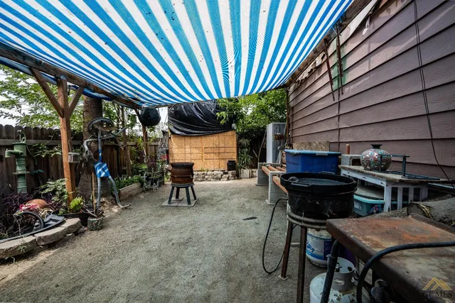 a view of a chairs and table in a patio
