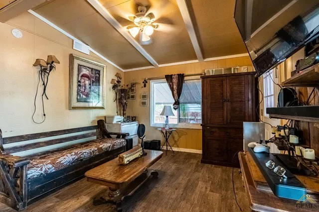 a living room with furniture a rug and a window