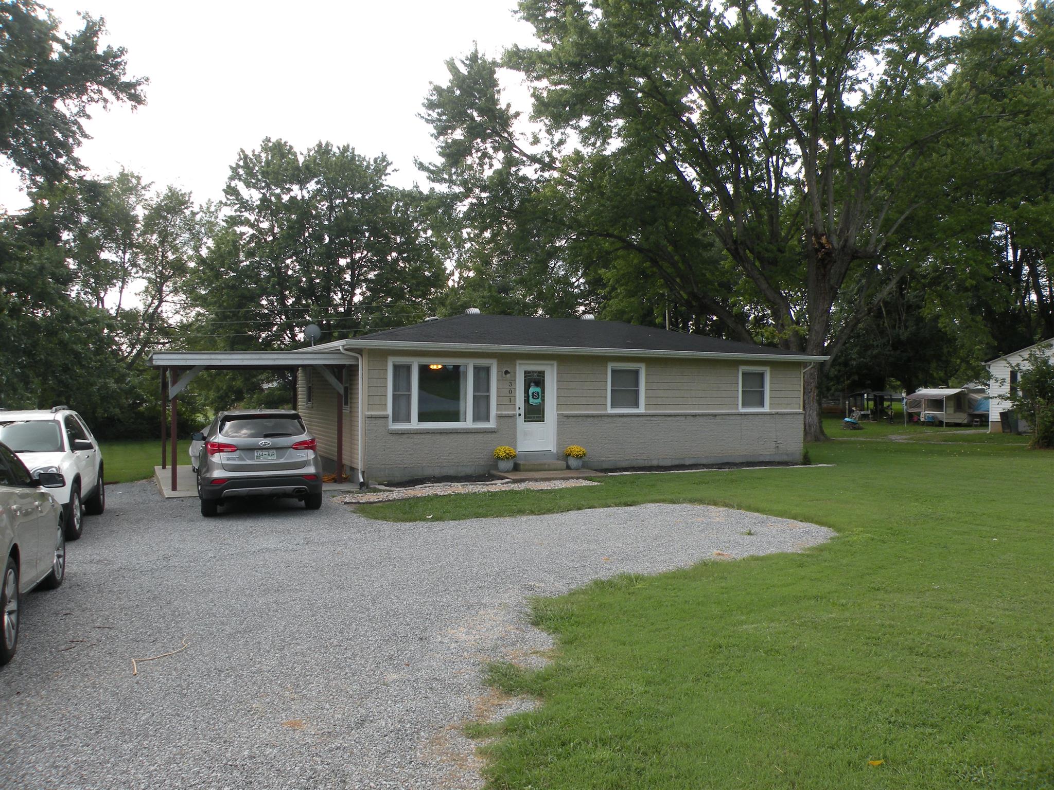 301 Fowler Ford Road Portland, TN 37148 - Photo 2 of 22 a car parked in front of a house and a yard